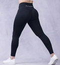 Mila high-waisted yoga leggings in Midnight Black, shown on model