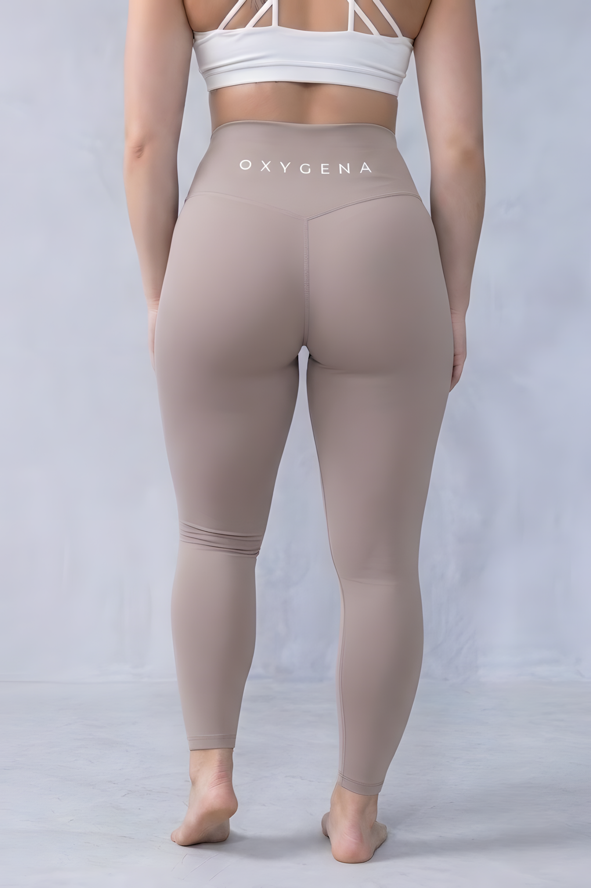 Mila yoga leggings in Oat, worn for yoga and training